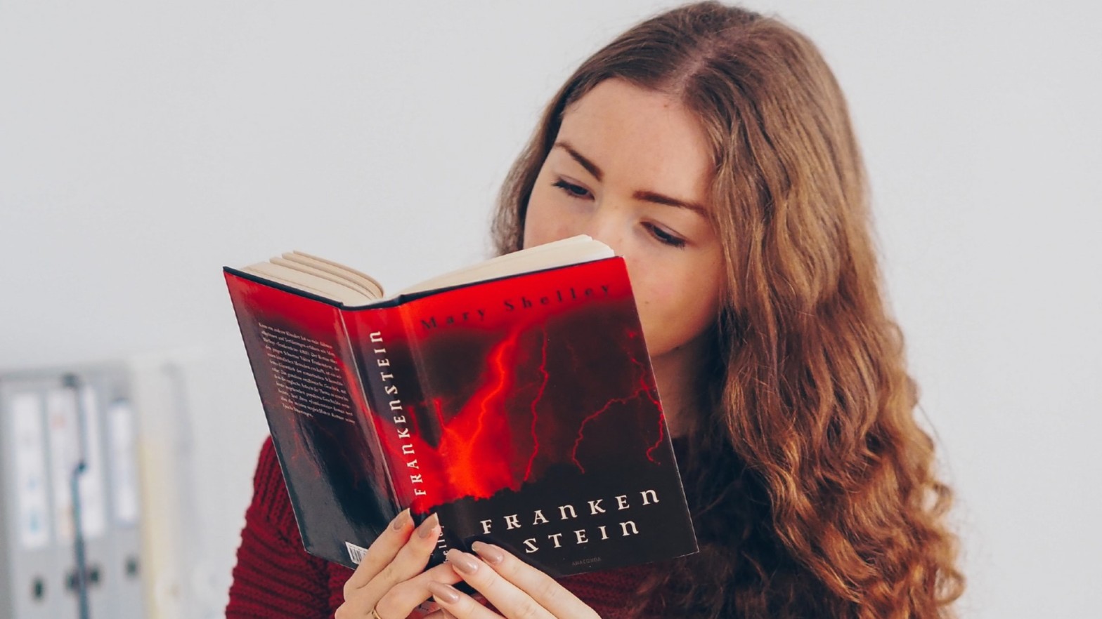 A girl reading Frankenstein